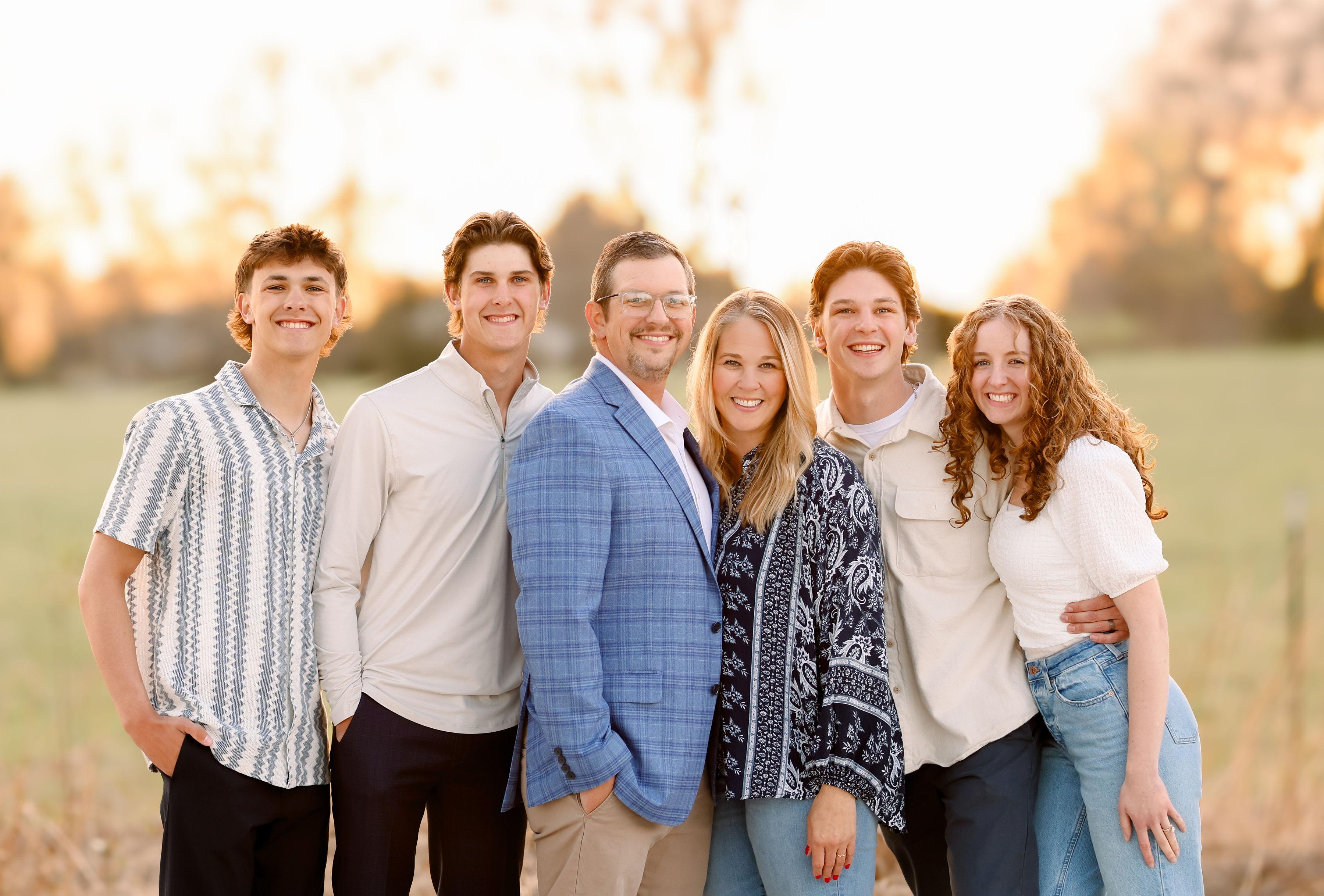 Jeremy Godwin standing outdoors with his family.